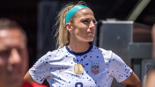 Julie Ertz stands on the sidelines before a game between the United States and Wales.