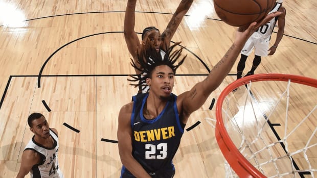 Armaan Franklin lays the ball in the basket during the Denver Nuggets Summer League game against the Utah Jazz in Las Vegas.
