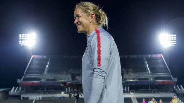 Former USWNT performance coach Dawn Scott smiles on the field as the United States trains in 2018.