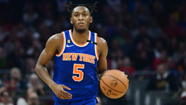 Mar 31, 2023; Cleveland, Ohio, USA; New York Knicks guard Immanuel Quickley (5) brings the ball up court during the first half against the Cleveland Cavaliers at Rocket Mortgage FieldHouse. Mandatory Credit: Ken Blaze-USA TODAY Sports