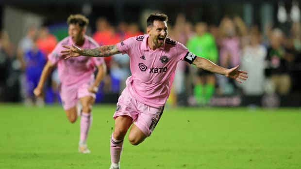 Lionel Messi celebrates after scoring a free kick with Inter Miami.