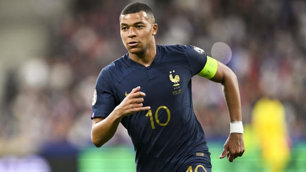 Kylian Mbappé playing for France.