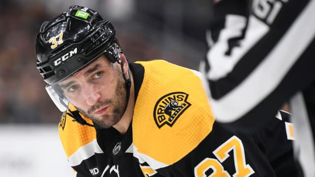 Bruins centre Patrice Bergeron gets ready for a face-off in 2023.