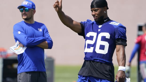 Jul 26, 2023; East Rutherford, NJ, USA; New York Giants running back Saquon Barkley (26) and quarterbacks coach Shea Tierney, left, at the Quest Diagnostics Training Facility.