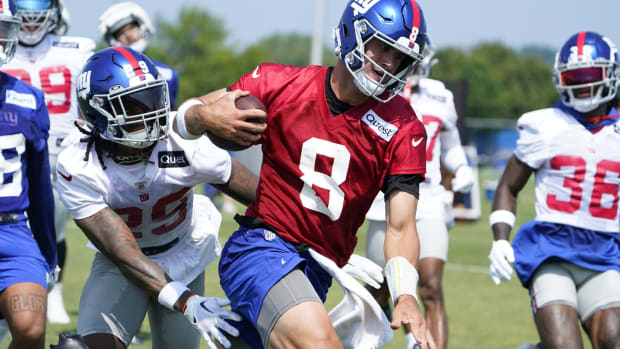 Jul 26, 2023; East Rutherford, NJ, USA; New York Giants quarterback Daniel Jones (8) runs with the ball on the first day of training camp at the Quest Diagnostics Training Facility.