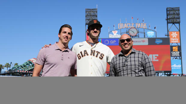 SF Giants general manager Pete Putila, first round draft pick Bryce Eldridge, and president of baseball operations Farhan Zaidi pose for a photo before the game against the Oakland Athletics at Oracle Park on July 26, 2023.