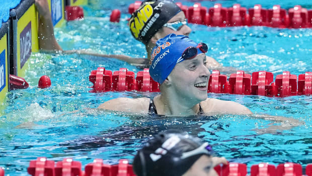 Nov 5, 2022; Indianapolis, Indiana, USA; Katie Ledecky (USA) smiles while looking at the time clock after breaking the 800 meter freestyle swim world record during the FINA Swimming World Cup finals at Indiana University Natatorium. Mandatory Credit: Grace Hollars/The Indianapolis Star via USA TODAY NETWORK