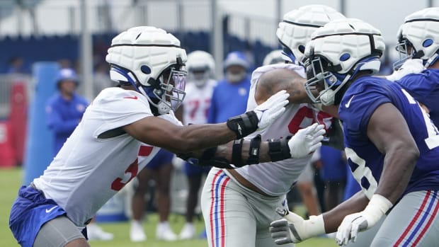 Jul 27, 2023; East Rutherford, NJ, USA; New York Giants defensive end Kayvon Thibodeaux, left, and offensive tackle Andrew Thomas, right, face off on day two of training camp at the Quest Diagnostics Training Facility.