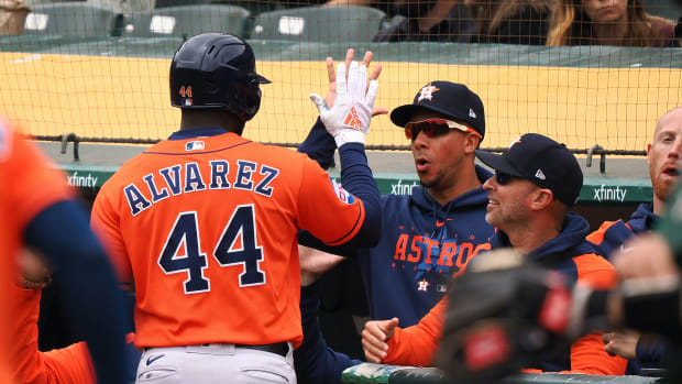 May 28, 2023; Oakland, California, USA; Houston Astros designated hitter Yordan Alvarez (44) high fives teammates in the dugout after hitting a solo home run against the Oakland Athletics during the first inning at Oakland-Alameda County Coliseum.