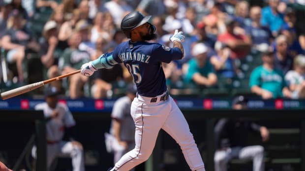 Seattle Mariners right fielder Teoscar Hernández hits a solo home run against the Minnesota Twins during the fourth inning at T-Mobile Park. (2023)