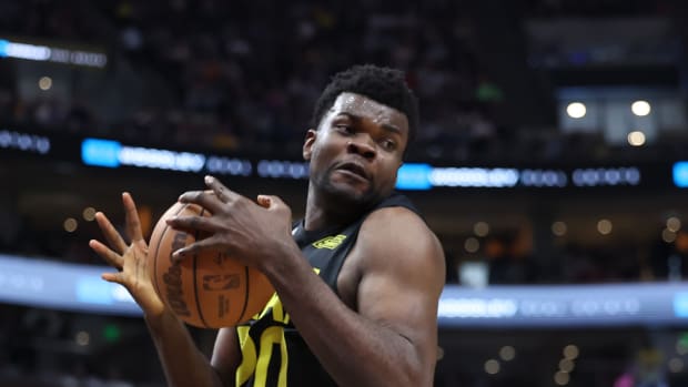 Utah Jazz center Udoka Azubuike (20) rebounds a ball against the Denver Nuggets in the second quarter at Vivint Arena.