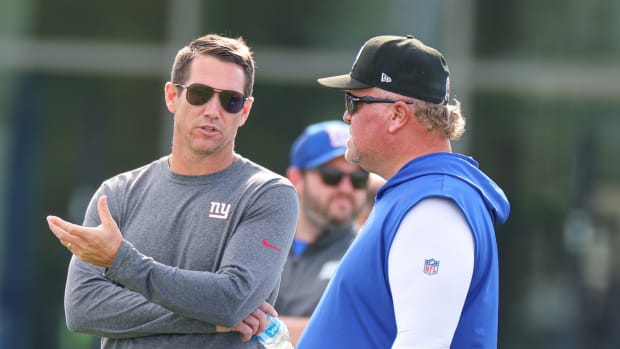 Aug 1, 2023; East Rutherford, NJ, USA; New York Giant general manager Joe Schoen talks with defensive coordinator Don Martindale during training camp at the Quest Diagnostics Training Facility.