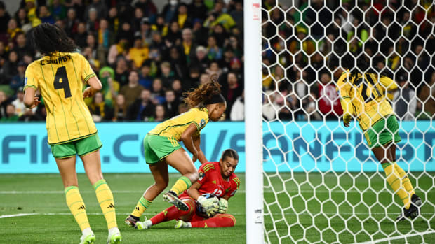 Jamaica goalkeeper Rebecca Spencer pictured (center) holding the ball during her team's 0-0 draw with Brazil at the 2023 FIFA Women's World Cup