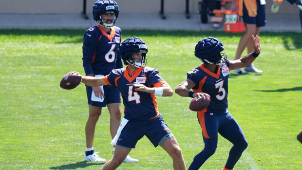 Denver Broncos quarterback Jarrett Stidham (4) and quarterback Russell Wilson (3) and quarterback Ben DiNucci (6) during drills at the Centura Health Training Center.