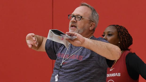 Razorbacks coach Mike Neighbors at practice Thursday before trip to Europe