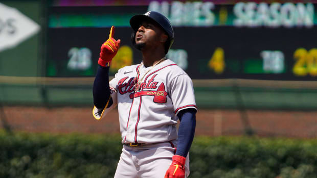 Aug 4, 2023; Chicago, Illinois, USA; Atlanta Braves second baseman Ozzie Albies (1) gestures after hitting a double against the Chicago Cubs during the fourth inning at Wrigley Field.
