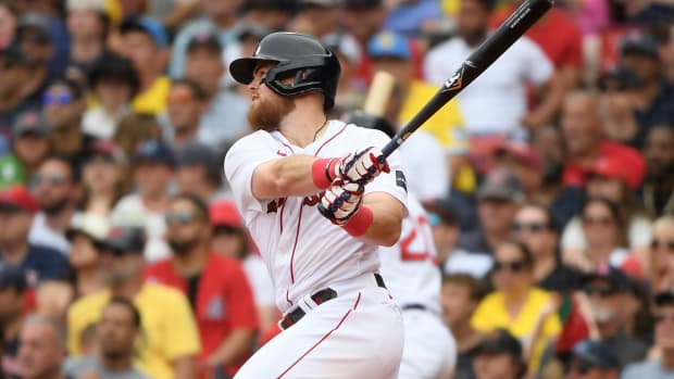 Boston Red Sox second baseman Christian Arroyo hits an RBI double during the sixth inning against the Oakland Athletics at Fenway Park. (2023)