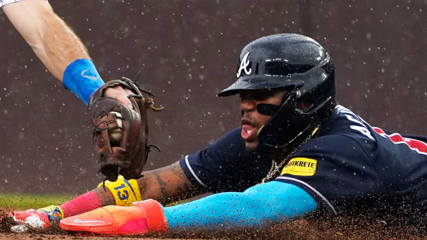 Aug 5, 2023; Chicago, Illinois, USA; Atlanta Braves right fielder Ronald Acuna Jr. (13) steals second base as Chicago Cubs shortstop Dansby Swanson (7) makes a late tag during the first inning at Wrigley Field.