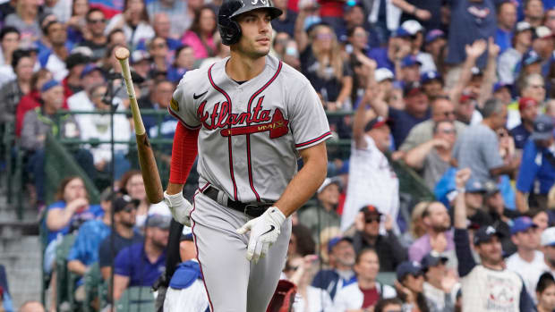 Aug 6, 2023; Chicago, Illinois, USA; Atlanta Braves first baseman Matt Olson (28) hits a two-run home run against the Chicago Cubs during the third inning at Wrigley Field.