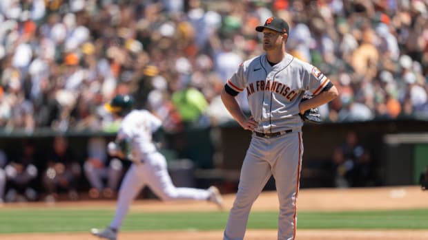 Aug 6, 2023; Oakland, California, USA; San Francisco Giants starting pitcher Alex Cobb (38) reacts as Oakland Athletics shortstop Nick Allen (2) runs the bases after hitting a two-run home run during the second inning at Oakland-Alameda County Coliseum.