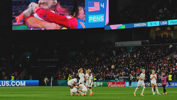 USWNT players console each other after shootout loss to Sweden