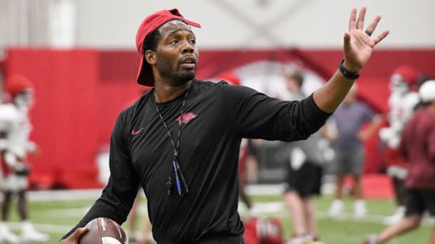 Razorbacks wide receivers coach Kenny Guiton during Tuesday morning's practice