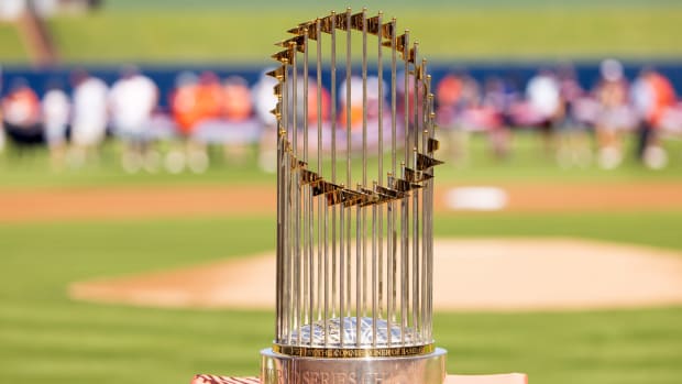 Feb 25, 2023; West Palm Beach, Florida, USA; The World Series trophy sits atop home plate prior to the game between the New York Mets and the Houston Astros at The Ballpark of the Palm Beaches.