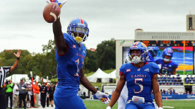 Sep 29, 2018; Lawrence, KS, USA; Kansas Jayhawks wide receiver Steven Sims Jr. (11) celebrates with wide receiver Stephon Robinson (5) after scoring a touchdown against the Oklahoma State Cowboys in the second half at Memorial Stadium. Mandatory Credit: Jay Biggerstaff-USA TODAY Sports  
