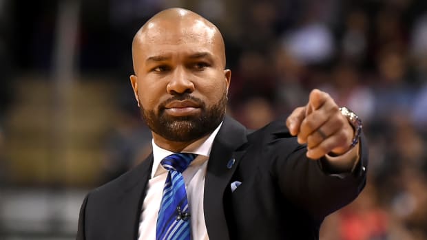 Former Knicks coach Derek Fisher stands on the sidelines during a game in 2016.