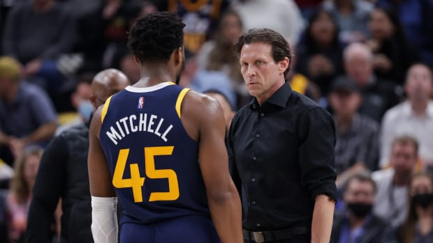 Utah Jazz guard Donovan Mitchell (45) and head coach Quin Snyder talk during a pause in play during the third quarter against the Orlando Magic at Vivint Arena.