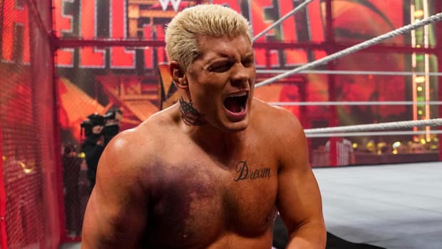A bruised Cody Rhodes winces during his match vs. Seth Rollins