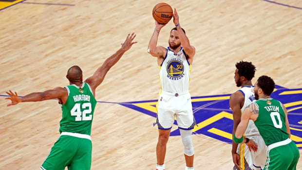 Jun 5, 2022; San Francisco, California, USA; Golden State Warriors guard Stephen Curry (30) shoots the ball against Boston Celtics center Al Horford (42) during game two of the 2022 NBA Finals at Chase Center.