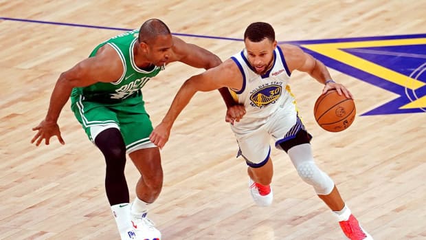 Jun 5, 2022; San Francisco, California, USA; Golden State Warriors guard Stephen Curry (30) drives to the basket against Boston Celtics center Al Horford (42) during game two of the 2022 NBA Finals at Chase Center.