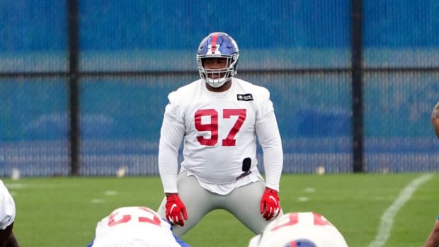 New York Giants tackle Dexter Lawrence (97) stretches during OTA practice at the Quest Diagnostics Training Center on Friday, June 4, 2021, in East Rutherford.