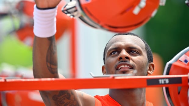 Cleveland Browns quarterback Deshaun Watson hangs his helmet on a rack after an NFL football practice at the team’s training facility Wednesday, June 8, 2022, in Berea, Ohio.