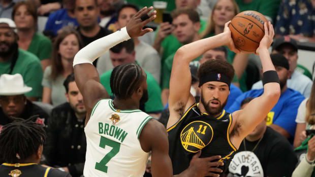 Jun 8, 2022; Boston, Massachusetts, USA; Golden State Warriors guard Klay Thompson (11) looks to pass the ball in front of Boston Celtics guard Jaylen Brown (7) in the first quarter during game three of the 2022 NBA Finals at TD Garden. Mandatory Credit: Kyle Terada-USA TODAY Sports