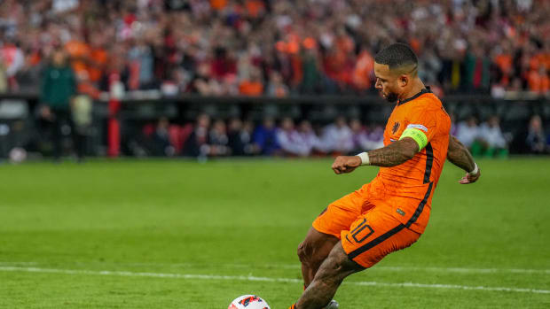 Memphis Depay pictured taking a penalty during Holland's 2-2 draw with Poland in June 2022