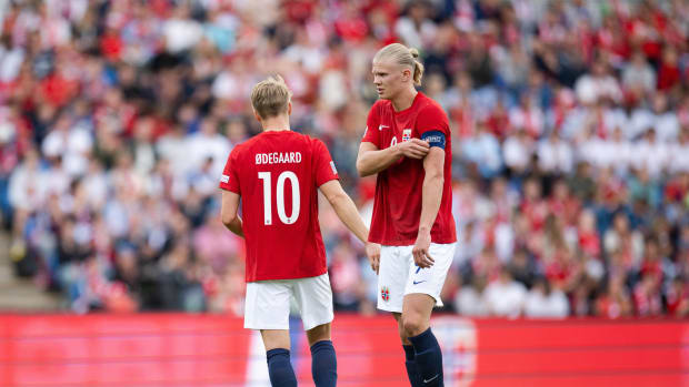 Erling Haaland pictured wearing the Norway captain's armband after taking it from Martin Odegaard (left) during their side's 3-2 win over Sweden in June 2022