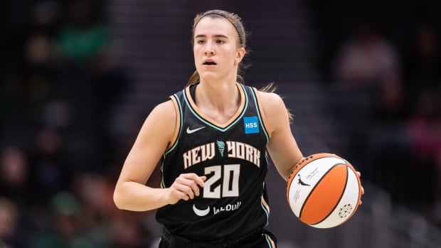 Liberty point guard Sabrina Ionescu dribbles a baseketball.