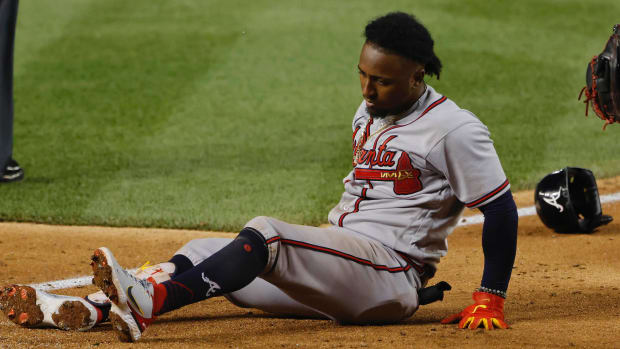 Atlanta Braves third baseman Ozzie Albies (1) sits at the batter's box after being injured while batting against the Washington Nationals during the fifth inning at Nationals Park.