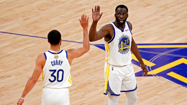 Jun 13, 2022; San Francisco, California, USA; Golden State Warriors forward Draymond Green (23) celebrates with Golden State Warriors guard Stephen Curry (30) during the first quarter against the Boston Celtics in game five of the 2022 NBA Finals at Chase Center. Mandatory Credit: Cary Edmondson-USA TODAY Sports