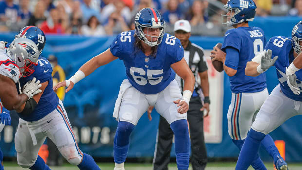 Aug 29, 2021; East Rutherford, New Jersey, USA; New York Giants center Nick Gates (65) blocks against the New England Patriots during the first half at MetLife Stadium.