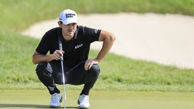 Jun 5, 2022; Dublin, Ohio, USA; Patrick Cantlay lines up a putt on the 18th green during the final round of the Memorial Tournament. Mandatory Credit: Aaron Doster-USA TODAY Sports