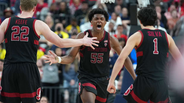 Mar 10, 2022; Las Vegas, NV, USA; Stanford Cardinal forward Harrison Ingram (55) celebrates with Stanford Cardinal forward James Keefe (22) and Stanford Cardinal guard Isa Silva (1) after scoring against the Arizona Wildcats during the second half at T-Mobile Arena
