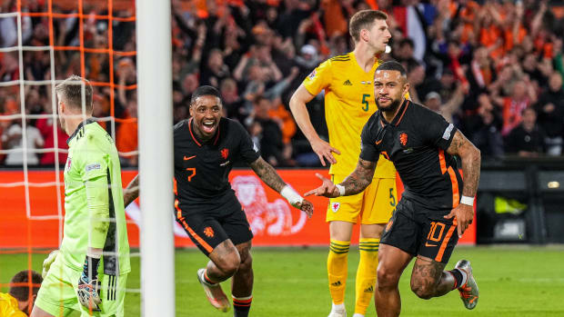 Memphis Depay pictured (right) after scoring the winning goal in Holland's 3-2 victory over Wales in June 2022