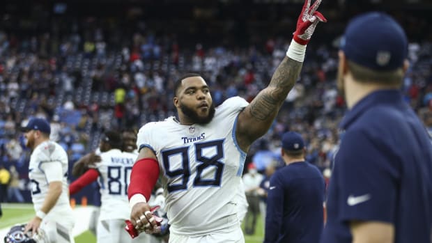 Tennessee Titans defensive end Jeffery Simmons (98) waves to the fans at the end of the game against the Houston Texans at NRG Stadium.