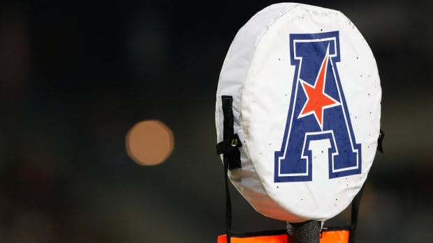 A detailed view of the American Athletic Conference logo on a field marker.