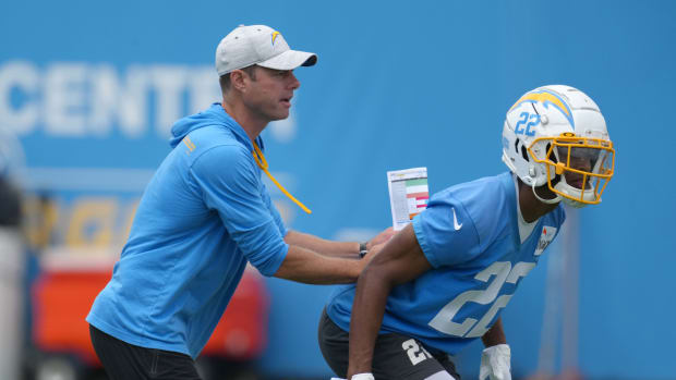 Jun 14, 2022; Costa Mesa, California, USA; Los Angeles Chargers coach Brandon Staley (left) and safety JT Woods (22) during minicamp at the Hoag Performance Center. Mandatory Credit: Kirby Lee-USA TODAY Sports