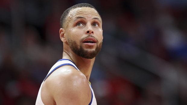 Warriors point guard Stephen Curry looks up at the scoreboard.