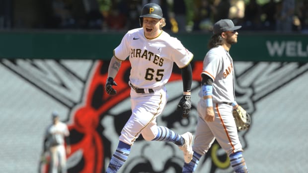 Pirates right fielder Jack Suwinski (65) smiles as he rounds the bases after his third solo home run of the game which was a walk off game winner in the ninth inning against the Giants.